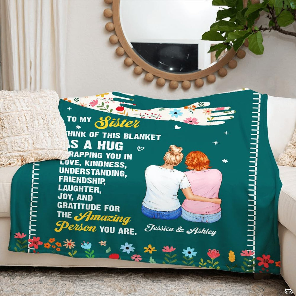 Close-up perspective of the sisterhood artwork on deep teal plum colored bedding.