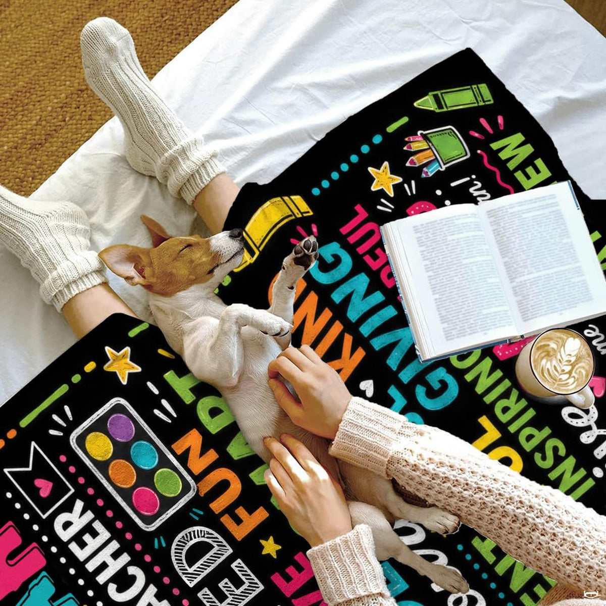 Playful school theme bedding set arranged neatly in a bright bedroom.