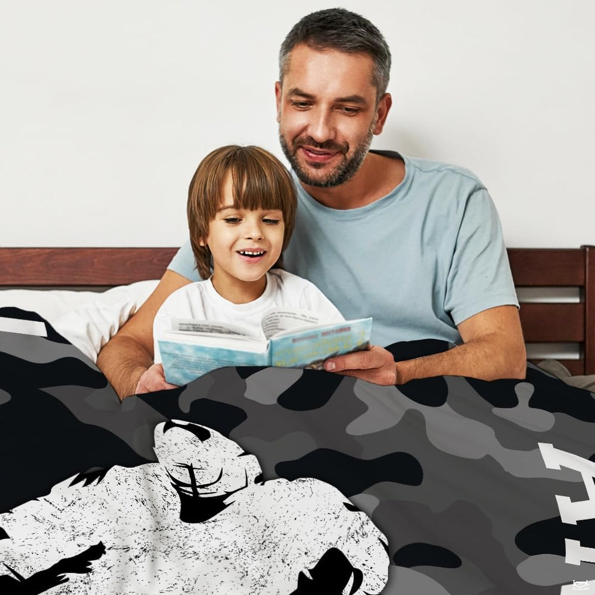 Bed mockup showing top section of camouflage hockey artwork with reading father and son.
