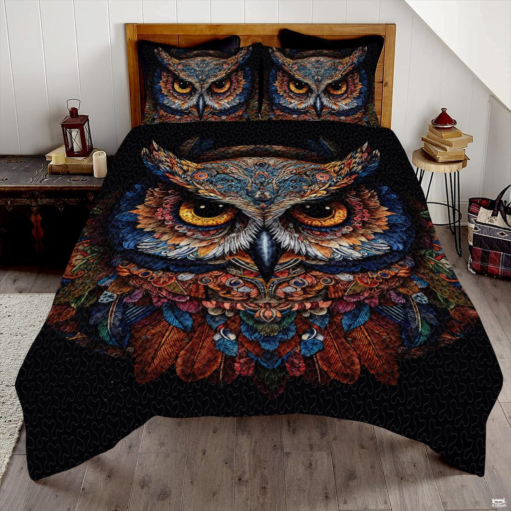 Moonlit silver and sapphire owl wildlife bedding set displayed neatly on a bed in a modern bedroom