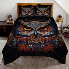 Moonlit silver and sapphire owl wildlife bedding set displayed neatly on a bed in a modern bedroom