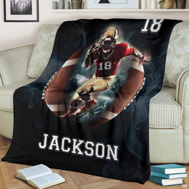 Gridiron breakthrough runner football blanket draped over sofa
