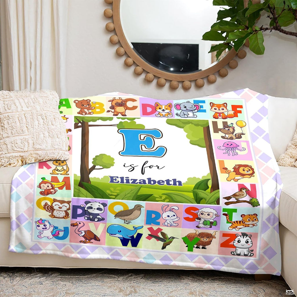 Illustrated A to Z cute animal alphabet chart surrounding central woodland meadow landscape, view 5.