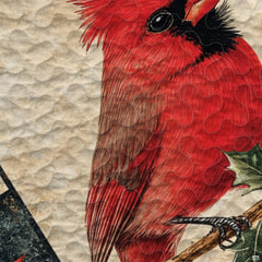 Detailed view of red cardinal perched on snowy pine sprigs within a rustic patchwork plaid visual.