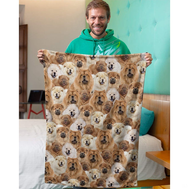 Person holding up a Chow Chow dog collage blanket in an indoor domestic room setting.