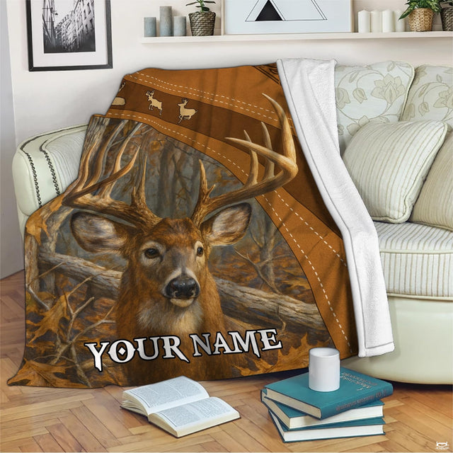 Close-up view of whitetail deer antlers, autumn oak leaves, and leaping deer icons.