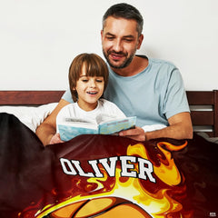 Close-up of blazing fire graphics and golden scroll accents on basketball bedroom decor.