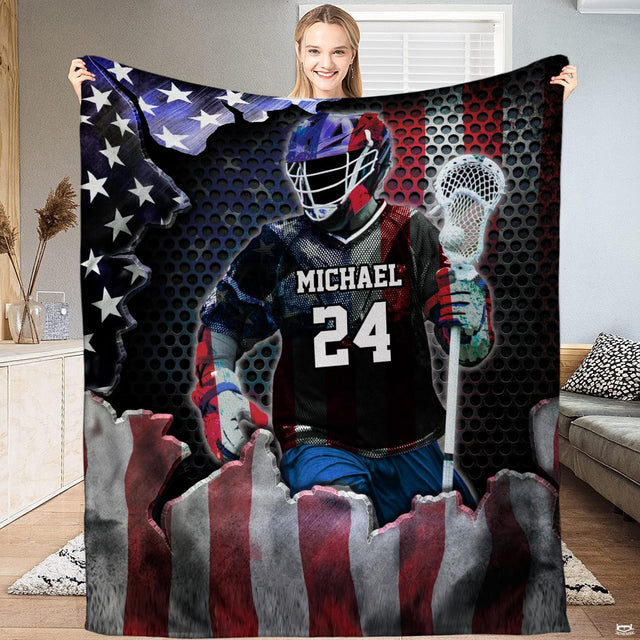 Patriotic lacrosse player blanket featuring athlete breaking through American flag over honeycomb backdrop.