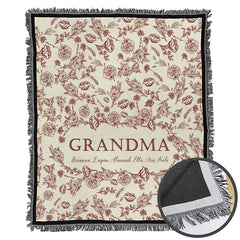 Close-up perspective of burgundy garden rose illustrations and fine line art on Blanket.