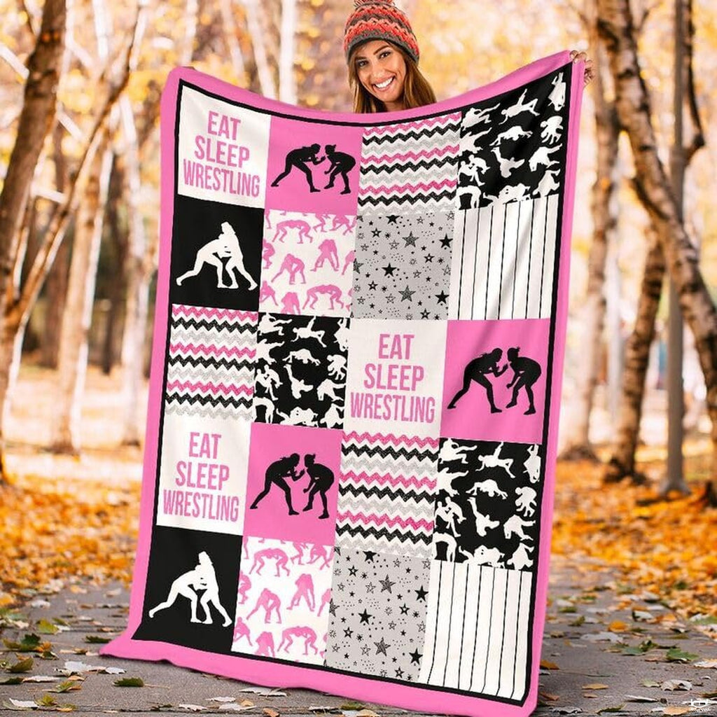 Close up view of wrestler silhouette blocks, star patterns, and hot pink chevron stripes.