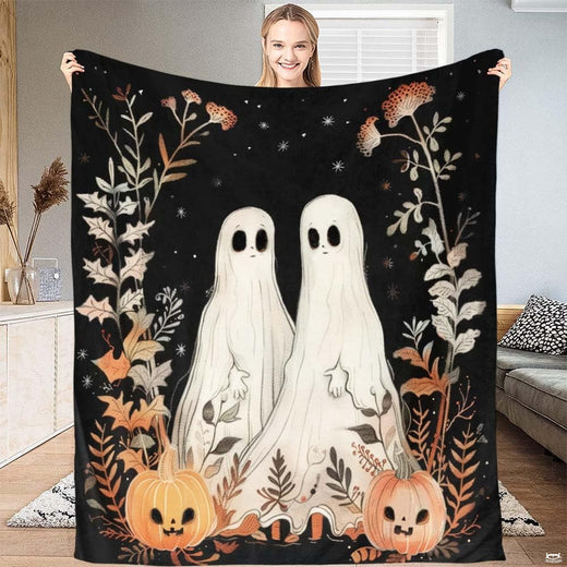 Ghost Halloween bedding featuring whimsical sheet ghosts, jack-o'-lantern pumpkins, and autumn leaves on black.