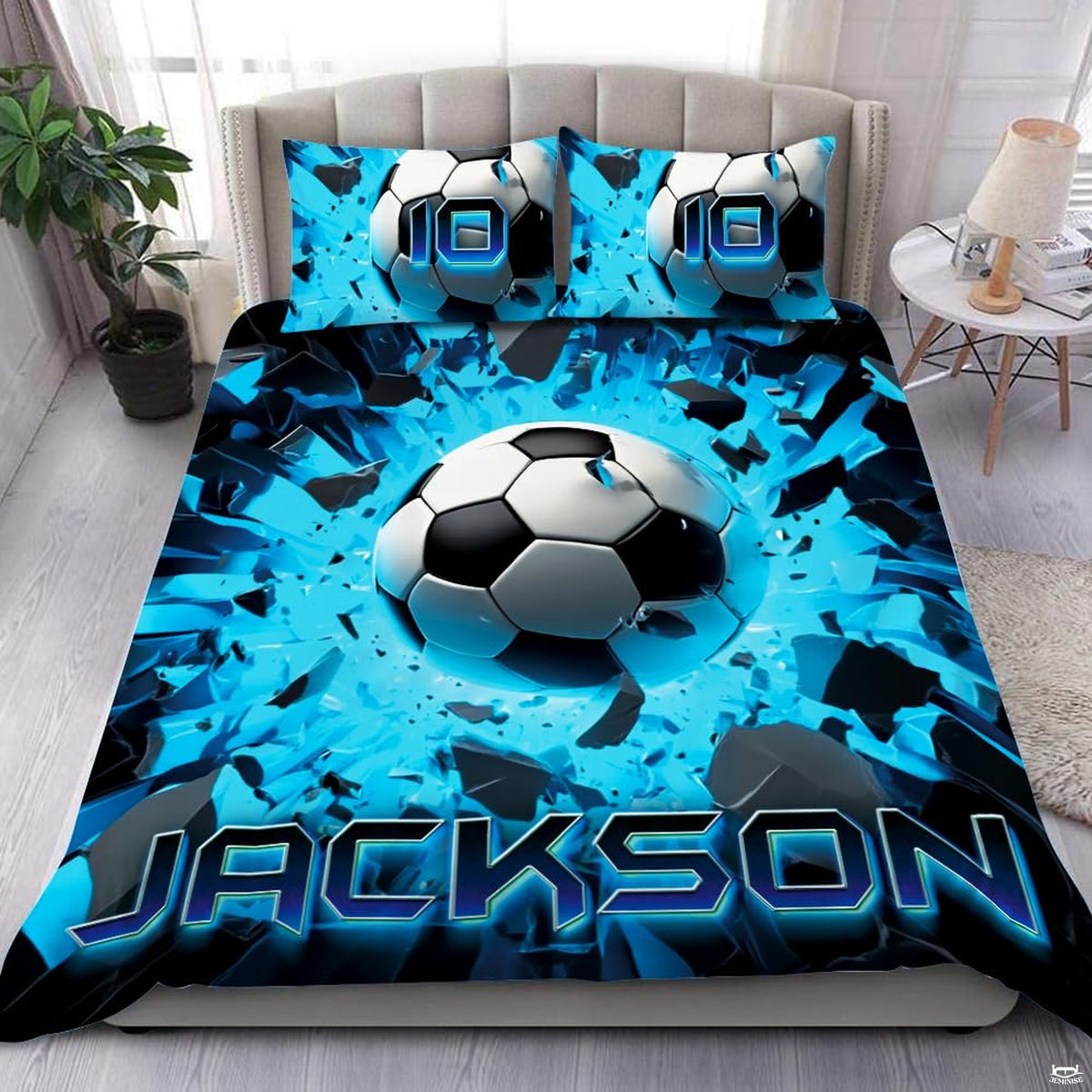 Electric cyan soccer ball splash graphic bedding set displayed neatly on a bed in a modern youth bedroom