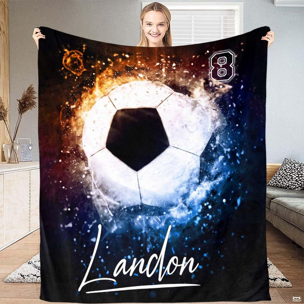 Soccer fire and ice blanket featuring soccer ball with blazing flames and electric blue ice crystals.