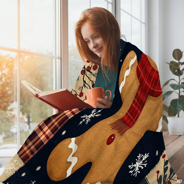 Festive Christmas holiday bedding display highlighting gingerbread artwork, red plaid accents, and winter evergreen motif.