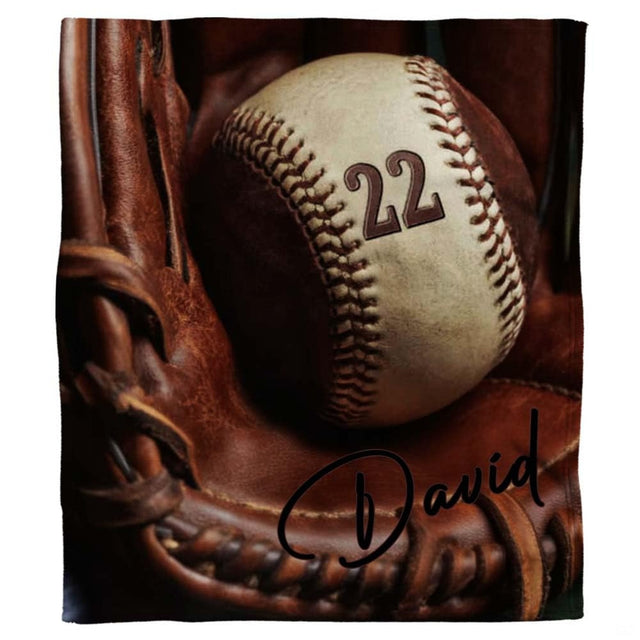 Vintage baseball throw blanket featuring baseball resting inside brown fielding glove webbing