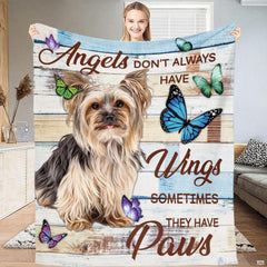 Living room sofa display showing the rustic Yorkie and butterflies throw blanket draped over furniture.