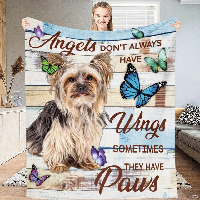 Living room sofa display showing the rustic Yorkie and butterflies throw blanket draped over furniture.