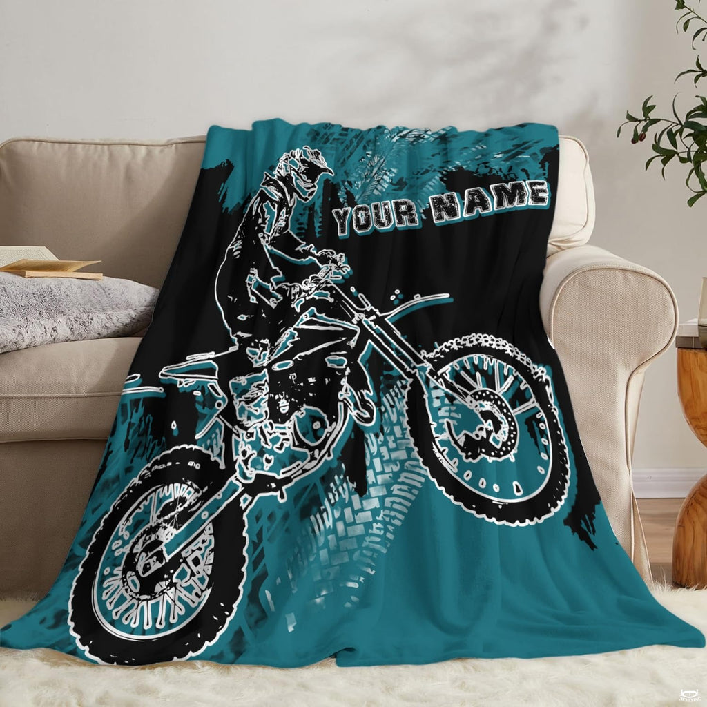 Stylized dirt bike scene with splash patterns across coordinating pillow shams.
