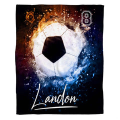Living room sofa setting displaying the soccer fire and ice sports throw blanket draped on furniture.