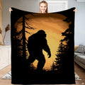 Bigfoot amber moon blanket featuring Sasquatch silhouette and pine trees within glowing vignette.