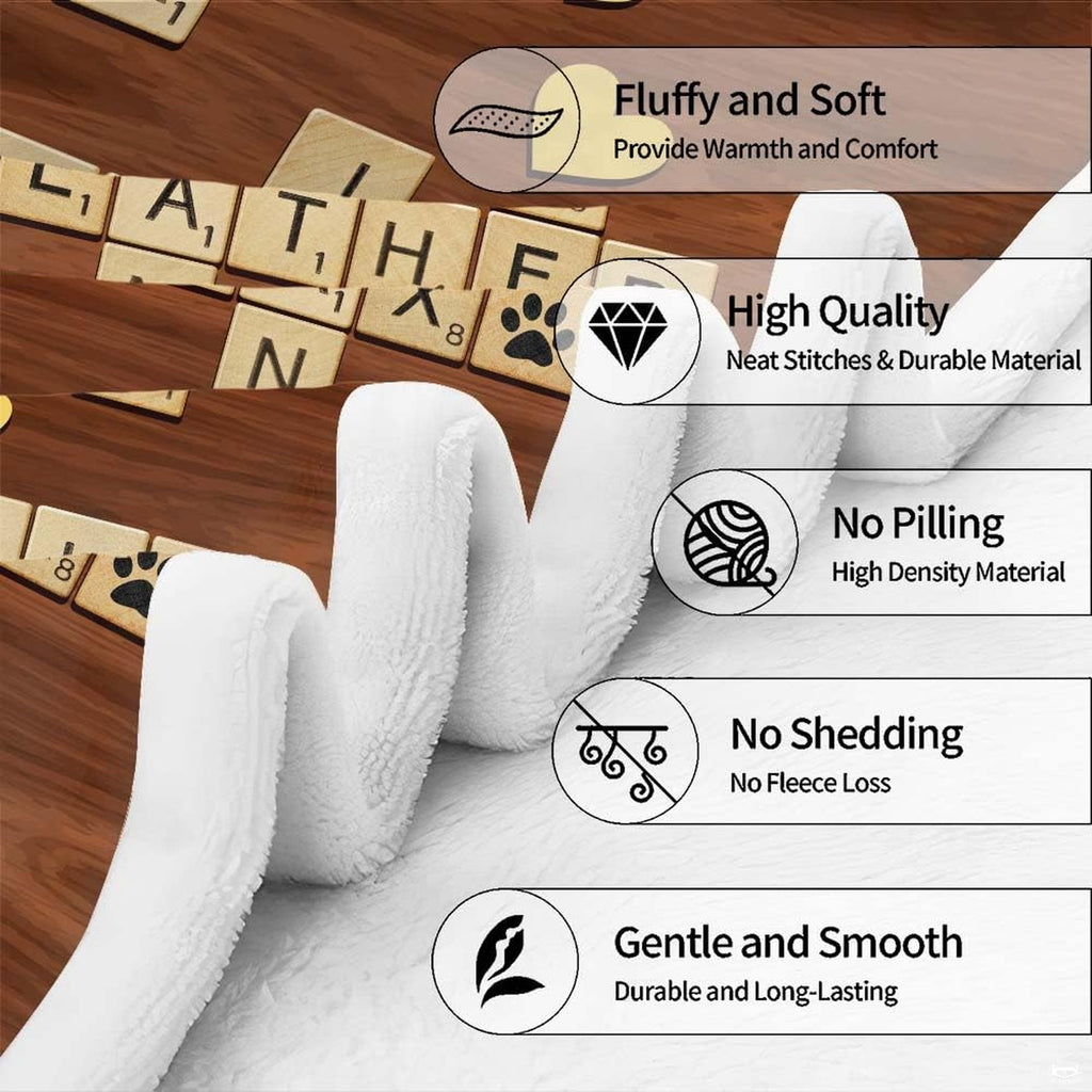 Folded display of crossword tiles blanket showing detailed edge hem and clear graphic print.
