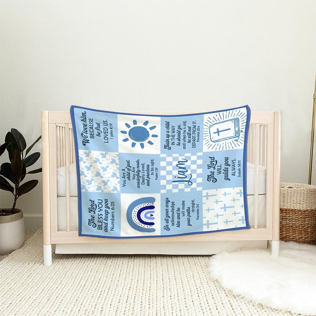 Blue faith scripture throw blanket draped across an armchair in a baby nursery