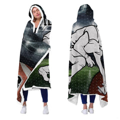 Football lineman stadium throw blanket held open showing night arena floodlights and gridiron player