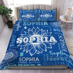 Blue floral bedding set featuring large sunflower artwork and butterflies on royal blue background.