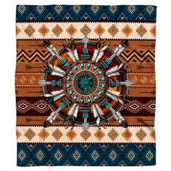 Close view of circular mandala motif with suspended feathers on turquoise boho bedding.