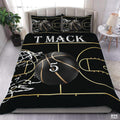 Black and gold basketball court sports bedding set spread over a bed with golden court lines.