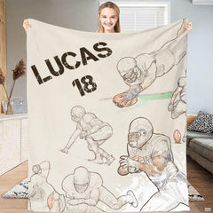Woman holding up football action throw blanket featuring vintage sports sketch illustrations