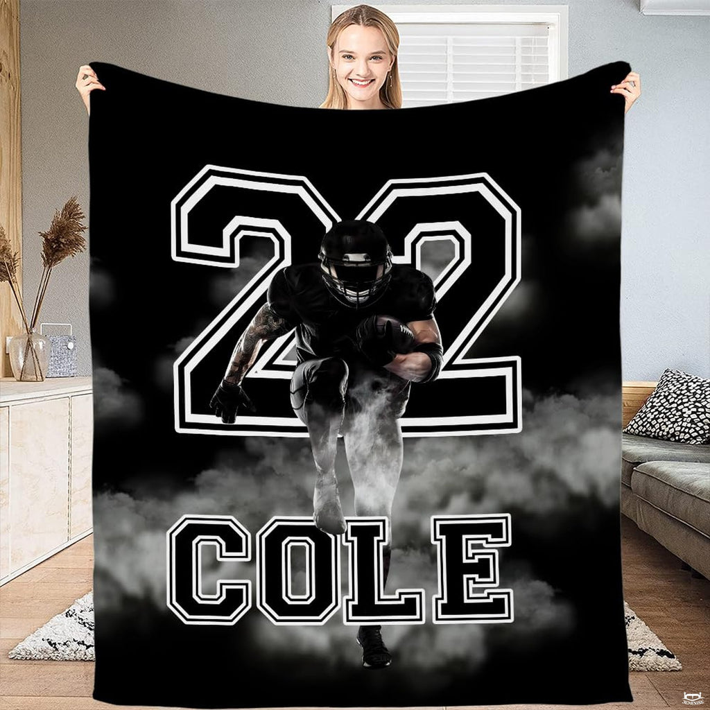 Football running back smoke burst throw blanket displaying charging athlete and varsity numbers