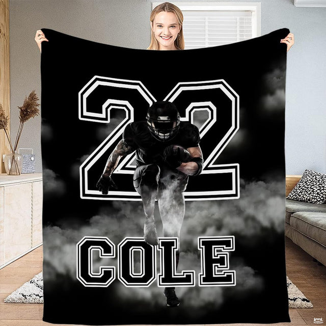 Football running back smoke burst throw blanket displaying charging athlete and varsity numbers