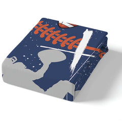 Corner angle of sports bedding highlighting crisp white cross printing and vibrant orange arc accents