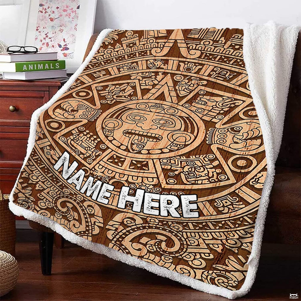 Woodgrain sun calendar graphic textile draped over armchair beside reading books.