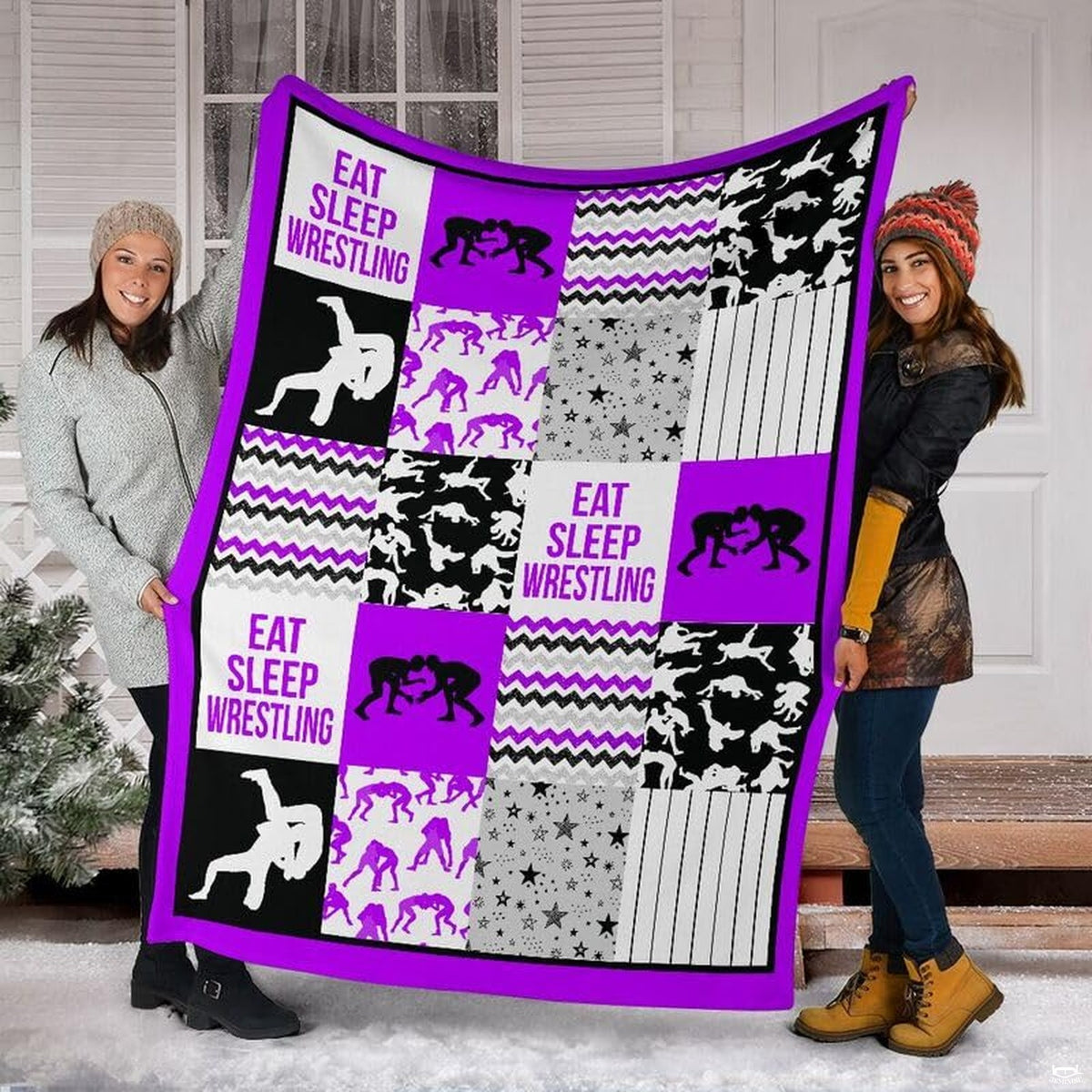 Detail view of neat hemmed edge and high-contrast printing on purple wrestling blanket.