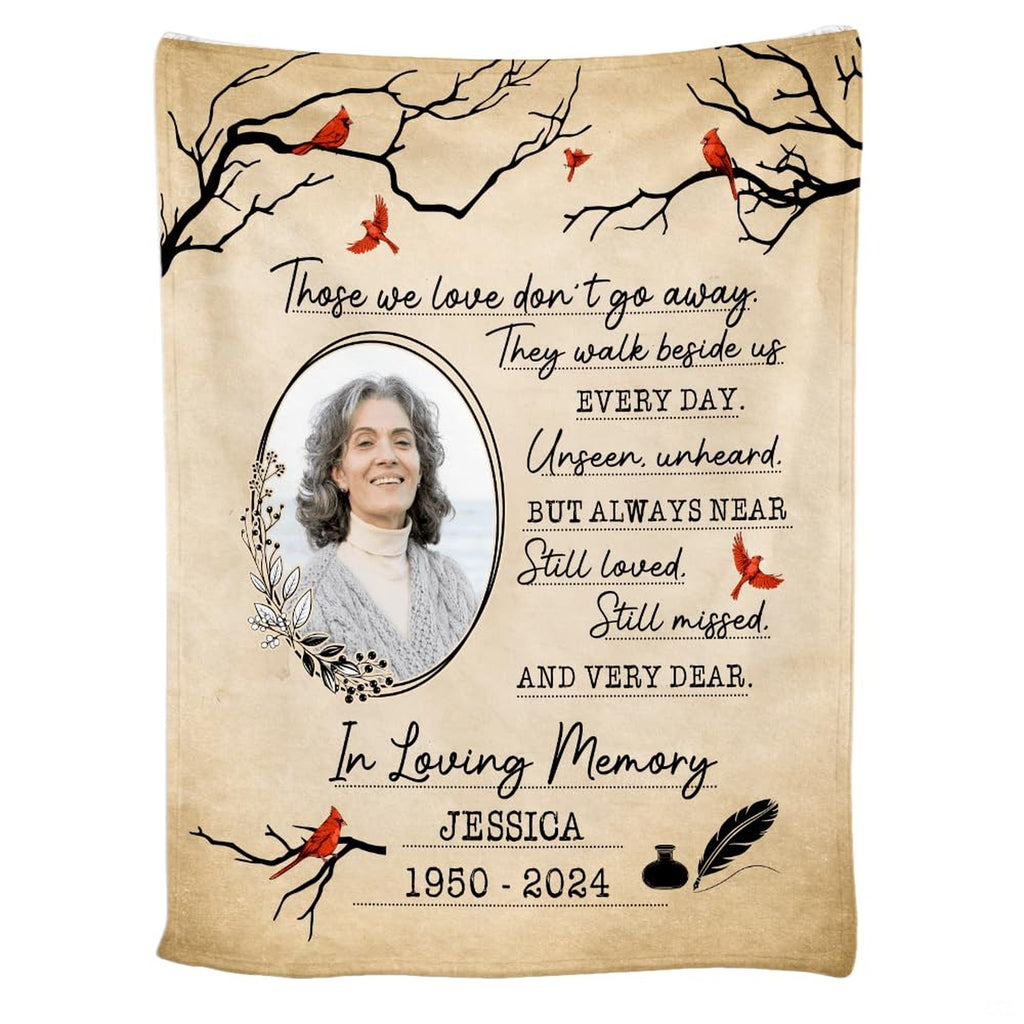 Cardinal memorial throw blanket draped over a living room couch
