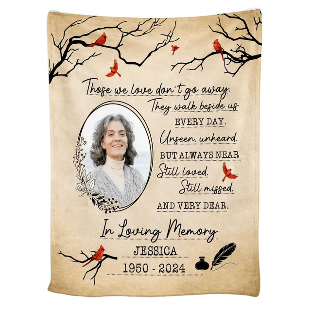 Cardinal memorial throw blanket draped over a living room couch