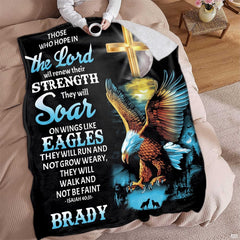 Person resting on living room furniture with a devotional raptor and cross blanket drape.