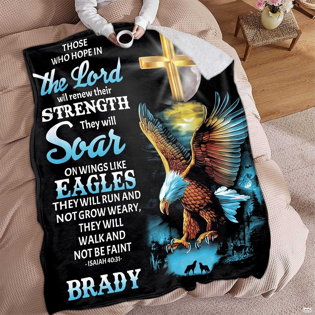 Person resting on living room furniture with a devotional raptor and cross blanket drape.