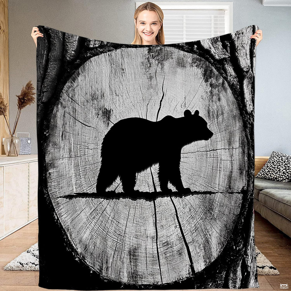 Rustic tree ring bear silhouette throw blanket featuring bear silhouette inside circular wood cross section