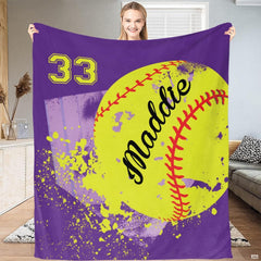 Close up macro view of purple softball throw blanket highlighting fabric texture and sharp team colors