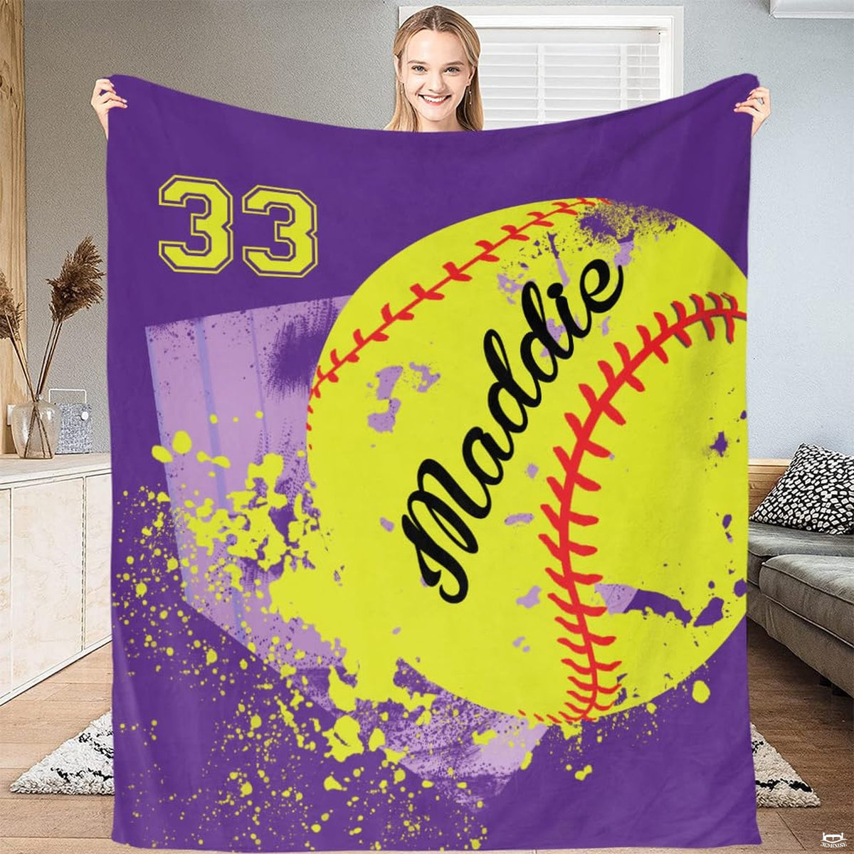 Close up macro view of purple softball throw blanket highlighting fabric texture and sharp team colors