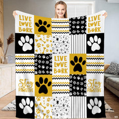 Golden dog paw print patchwork throw blanket with bold puppy paws and chevron zigzag blocks