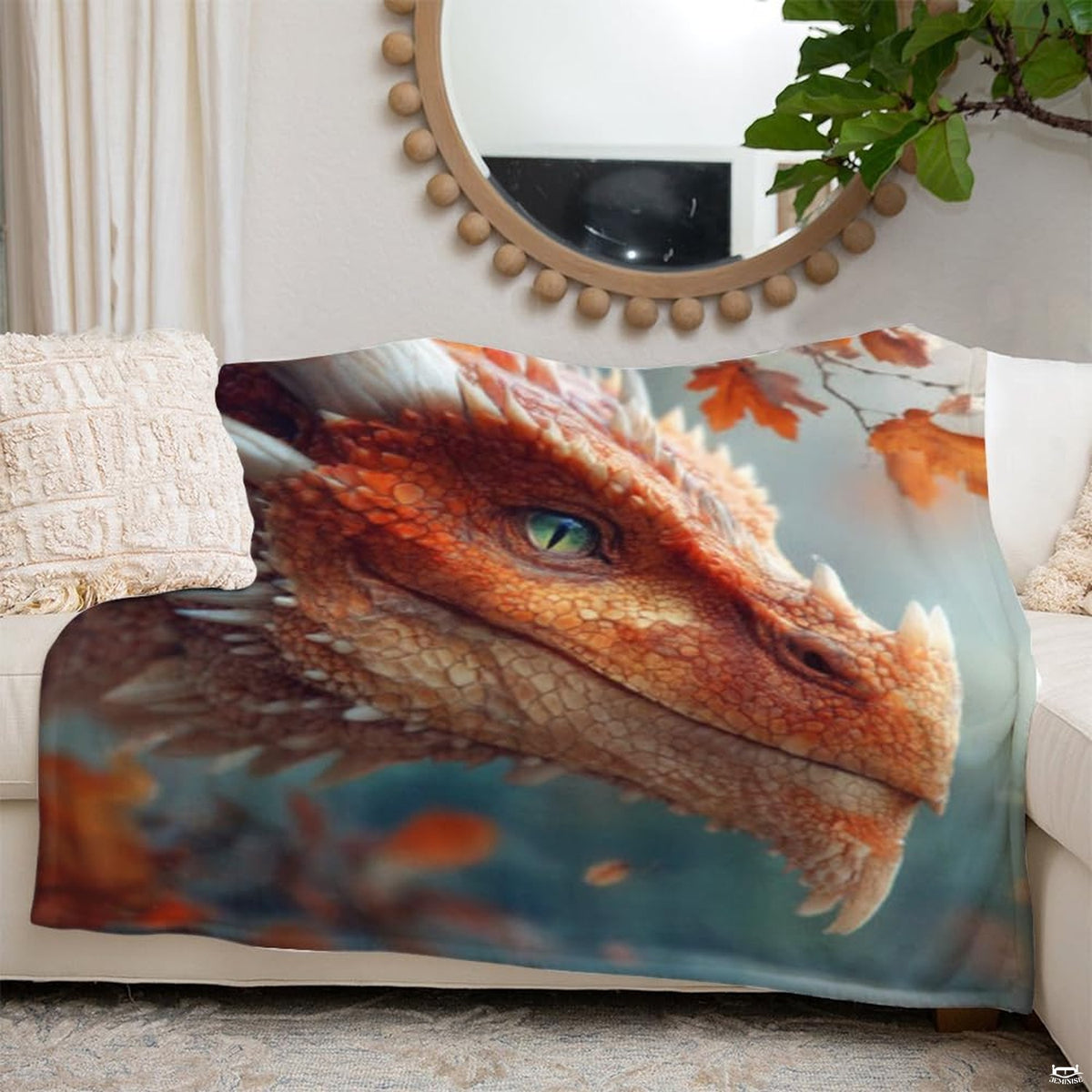 Fantasy red dragon blanket styled across a grey couch in a modern entertainment room