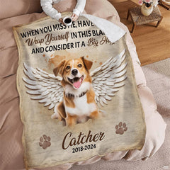 Dog angel wings sympathy throw blanket styled across a comfortable armchair