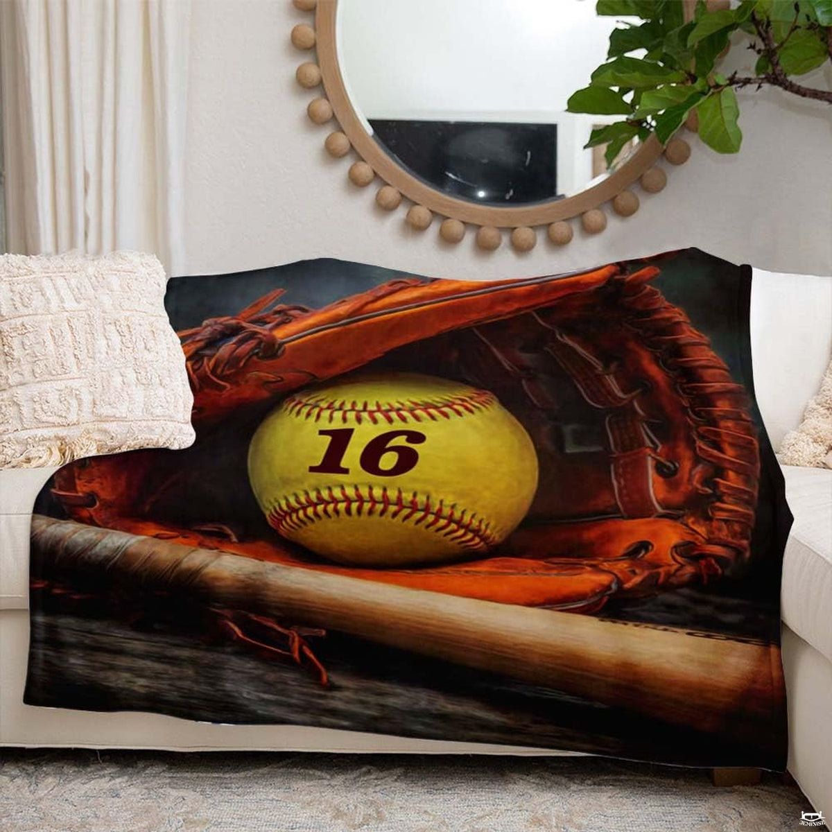 Dugout softball artwork blanket styled across modern couch sofa