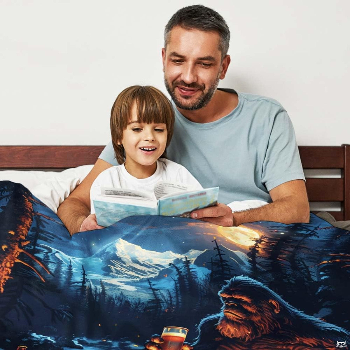 Bigfoot campfire beer mountain throw blanket view 2 styled on living room couch in modern home