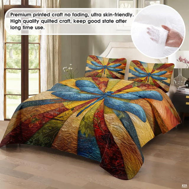 Close-up view of dragonfly bedding highlighting detailed insect wings, fall foliage, and patchwork blocks