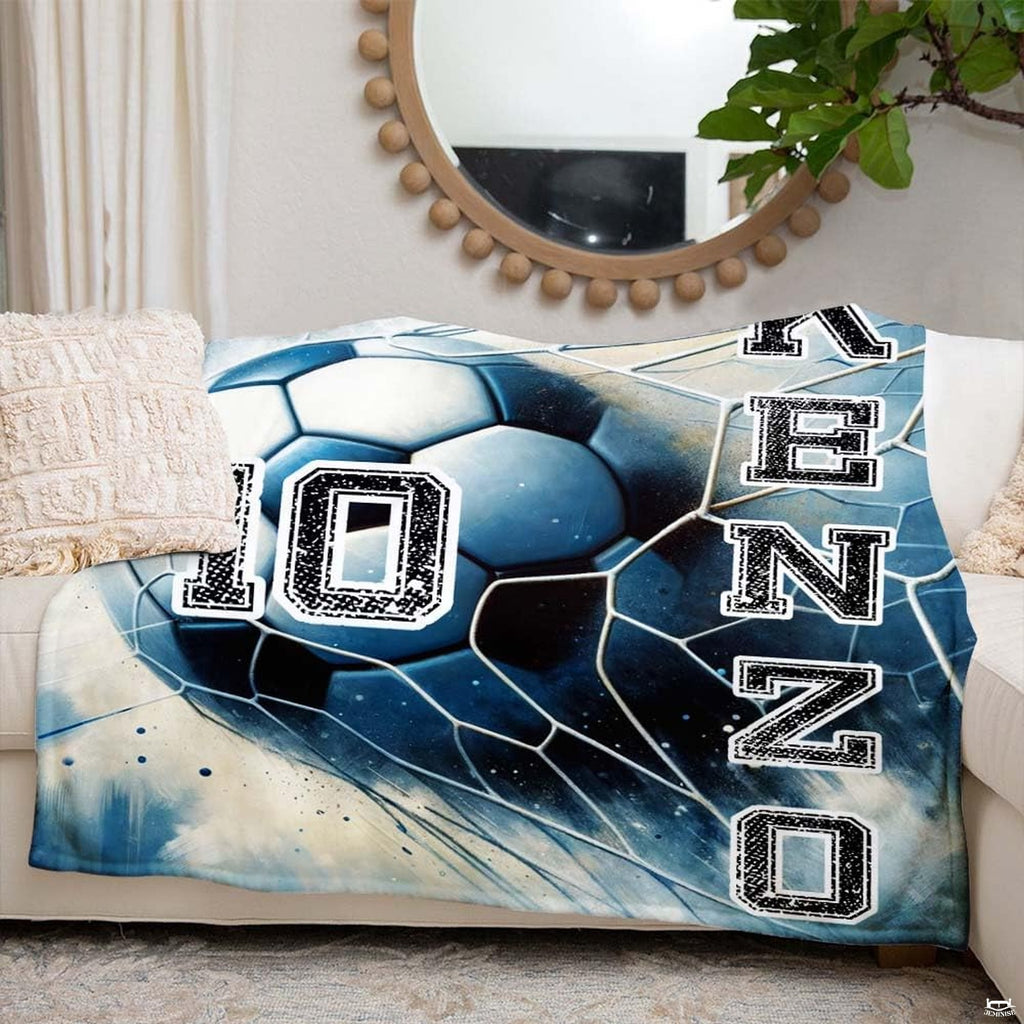 Soccer ball and goal net motif styled in an athletic bedroom with cool blue accents.
